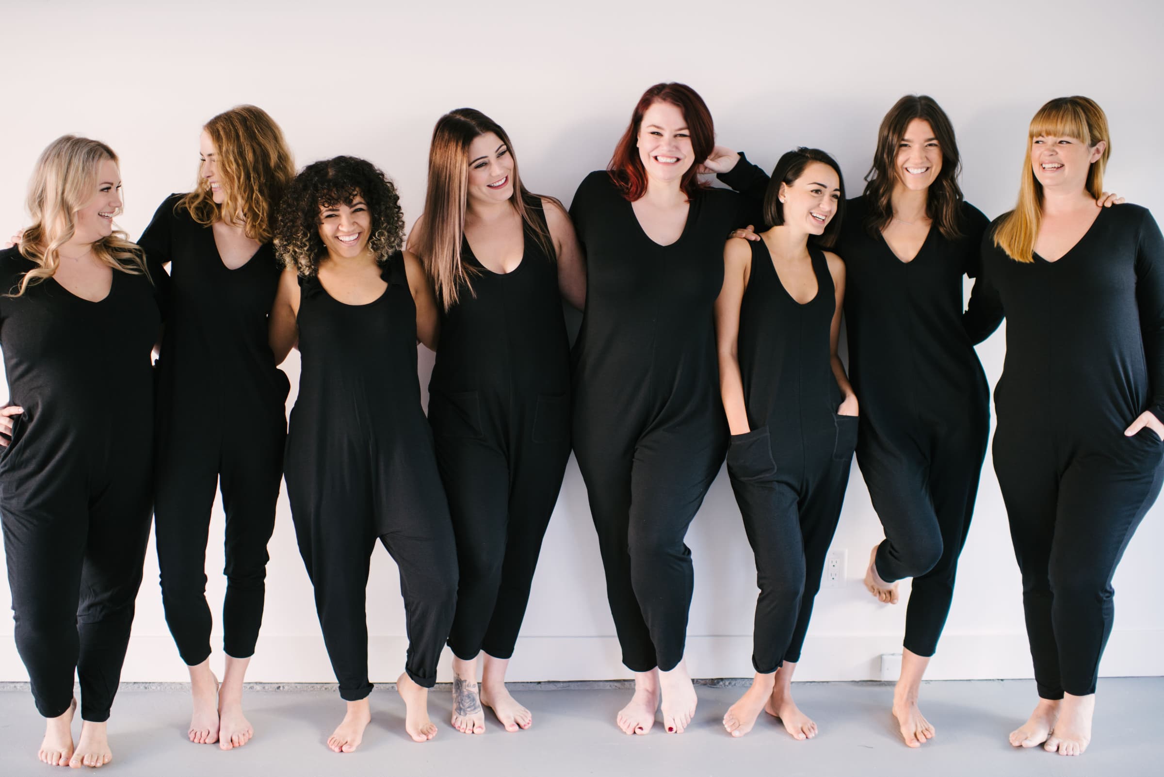 Group of ladies of different sizes wearing Smash + Tess Rompers